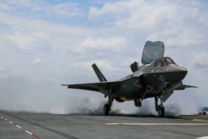 Aerospace and defense component with protective thermal spray coating for wear and corrosion resistance