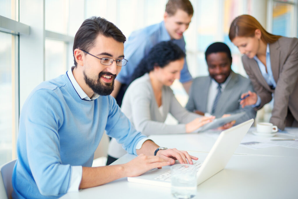 Office team collaborating on a project during a workplace meeting