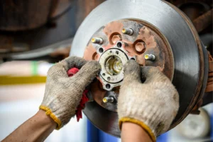 Automotive component for high-performance applications requiring durable materials and surface protection